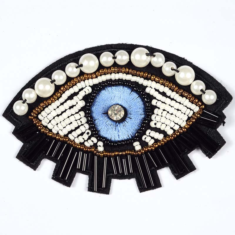 Intricate evil eye patch made of bugle beads, embroidery, and faux pearls for jackets and hats