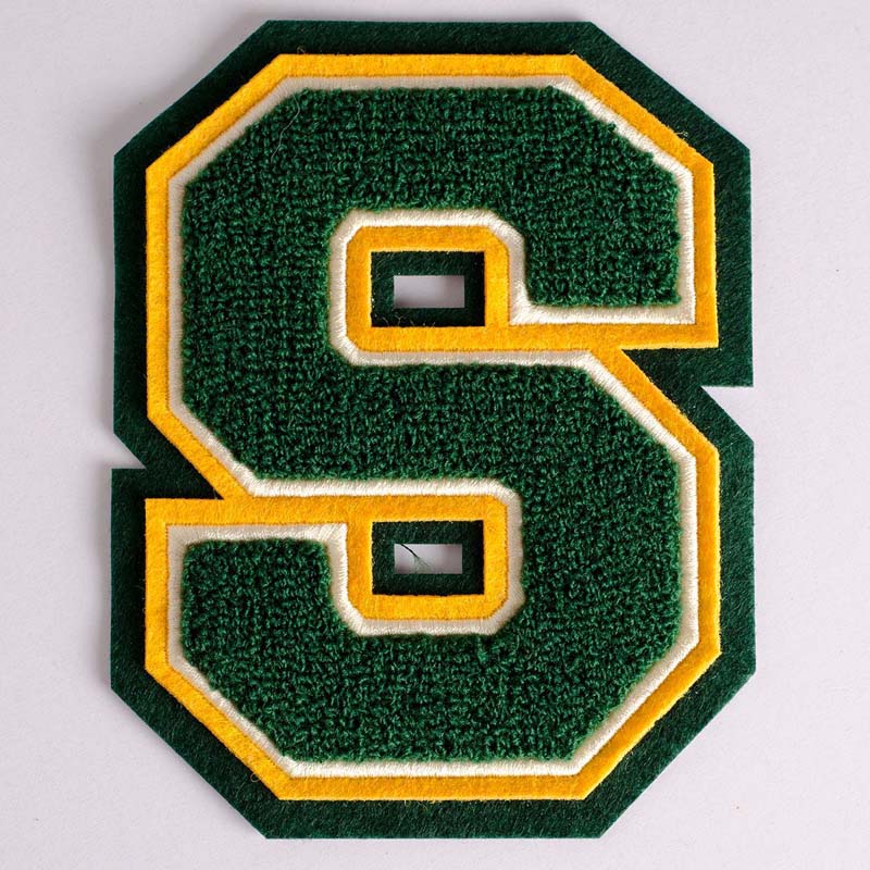 A premium 4*6cm vintage varsity chenille alphabet letter S patch featuring hot-melt adhesive backing for easy iron-on or sewing.